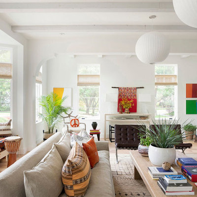 Living room library - eclectic light wood floor and beige floor living room library idea in Minneapolis with white walls