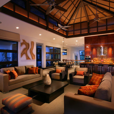 Inspiration for a huge tropical open concept and formal carpeted living room remodel in Miami with white walls and no tv