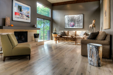 Mid-sized trendy formal and enclosed light wood floor living room photo in Sacramento with gray walls, a standard fireplace and a stone fireplace