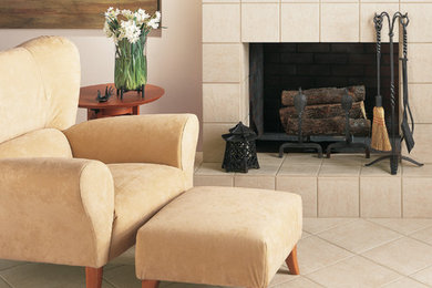 Example of a mid-sized classic formal and enclosed ceramic tile and beige floor living room design in Denver with beige walls, a standard fireplace, a tile fireplace and no tv
