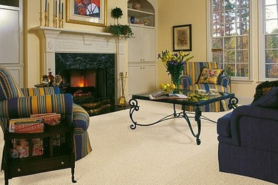 Large elegant formal and open concept carpeted and beige floor living room photo in New York with yellow walls, a wood fireplace surround, a standard fireplace and no tv