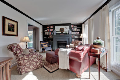 Example of a small classic enclosed carpeted living room library design in Chicago with beige walls, a standard fireplace, a wood fireplace surround and no tv