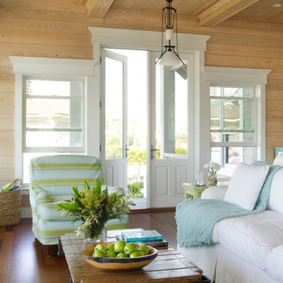 Beach style medium tone wood floor living room photo in Miami with no fireplace