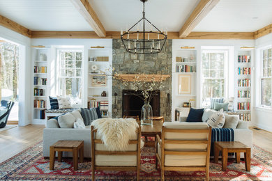 Large transitional open concept light wood floor living room photo in Portland Maine with white walls, a standard fireplace, a stone fireplace and no tv