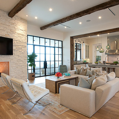 Living room - transitional open concept beige floor living room idea in Austin with a wall-mounted tv