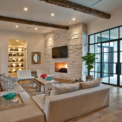 Inspiration for a transitional medium tone wood floor living room remodel in Austin with white walls, a corner fireplace and a wall-mounted tv