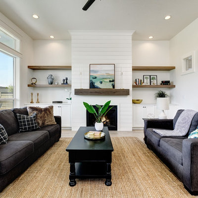 Living room - transitional formal light wood floor living room idea in Boise with white walls, a standard fireplace and no tv