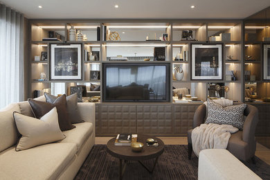 Medium sized contemporary open plan living room in London with grey walls, light hardwood flooring and a built-in media unit.