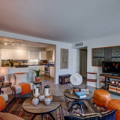 Living room - mid-sized eclectic open concept living room idea in Phoenix with no fireplace and a tv stand