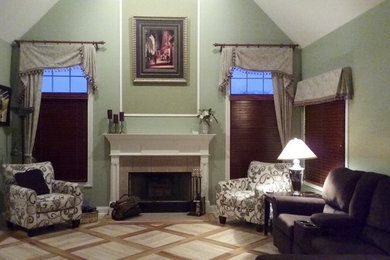 Example of a vinyl floor and multicolored floor living room design in Chicago with green walls, a standard fireplace, a tile fireplace and no tv