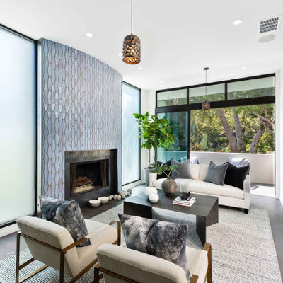Living room - mid-sized contemporary enclosed and formal gray floor living room idea in Los Angeles with white walls, a standard fireplace, a tile fireplace and no tv