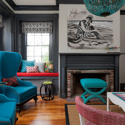 Inspiration for an eclectic enclosed light wood floor living room remodel in Boston with a brick fireplace, gray walls, a standard fireplace and no tv