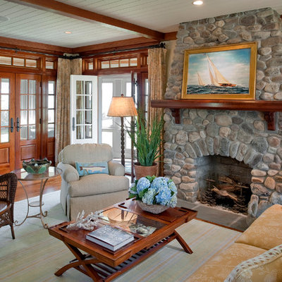 Living room - mid-sized formal and enclosed dark wood floor living room idea in Providence with beige walls, a standard fireplace, a stone fireplace and no tv