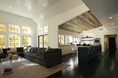 Example of a cottage open concept dark wood floor living room design in New York with white walls