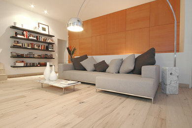 Example of a mid-sized trendy formal and open concept light wood floor and white floor living room design in Denver with white walls