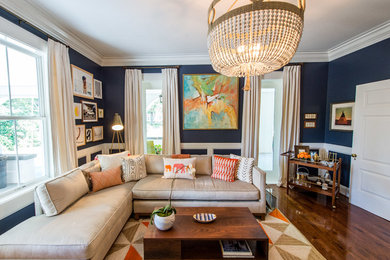 Living room - mid-century modern dark wood floor living room idea in Nashville with blue walls