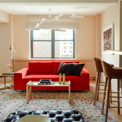 Example of a trendy open concept light wood floor living room design in New York with beige walls