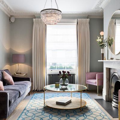 Living room - transitional enclosed and formal light wood floor and beige floor living room idea in London with a standard fireplace, a stone fireplace, blue walls and no tv