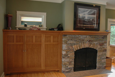 Mid-sized arts and crafts enclosed living room photo in Burlington with a media wall