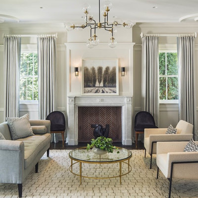 Example of a mid-sized transitional formal and open concept dark wood floor and brown floor living room design in New York with gray walls, a standard fireplace, a stone fireplace and no tv