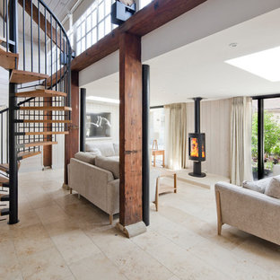 Inspiration for a farmhouse open plan living room in Other with white walls and beige floors.