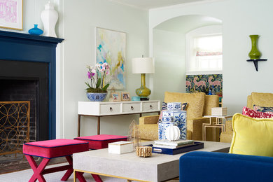 Photo of a classic formal living room in Philadelphia with white walls, a standard fireplace and feature lighting.