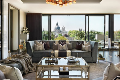 Photo of a contemporary formal open plan living room in London with white walls and dark hardwood flooring.