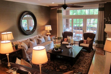 Large elegant medium tone wood floor living room photo in Chicago with gray walls