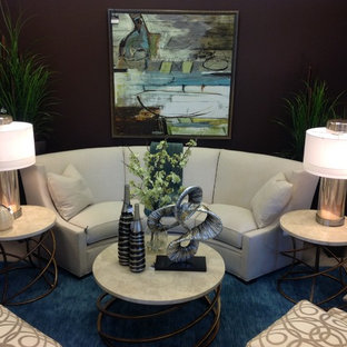 Living room - mid-sized eclectic enclosed carpeted living room idea in Other with brown walls and no fireplace