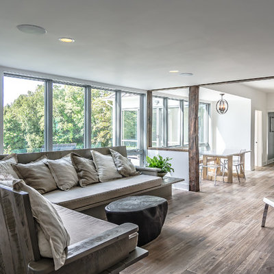 Inspiration for a contemporary open concept living room remodel with white walls