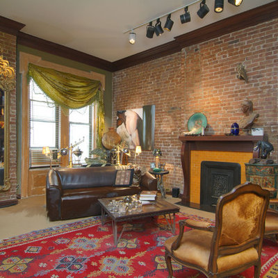 Inspiration for a mid-sized eclectic enclosed carpeted living room remodel in New York with a standard fireplace and a wood fireplace surround