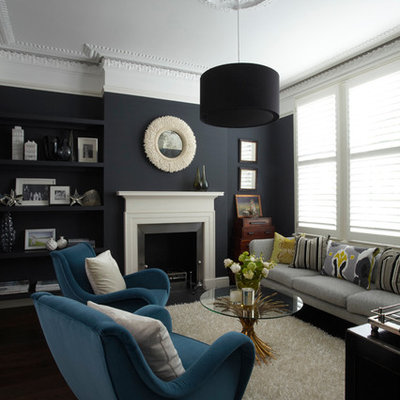 Mid-sized trendy formal living room photo in London with blue walls, a standard fireplace and no tv
