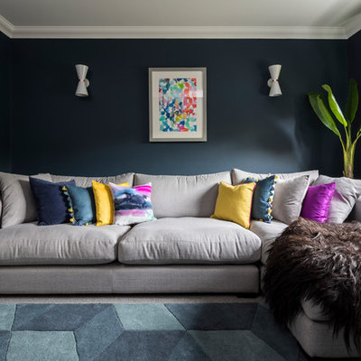 Mid-sized transitional enclosed carpeted and gray floor living room photo in Surrey with blue walls