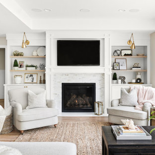 Living room - mid-sized transitional open concept medium tone wood floor and brown floor living room idea in San Francisco with gray walls, a standard fireplace, a stone fireplace and a wall-mounted tv