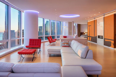 Living room - large contemporary loft-style beige floor living room idea in Chicago with white walls, a ribbon fireplace and a stone fireplace