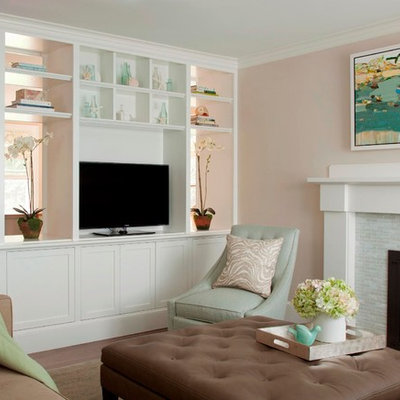Example of a large beach style open concept medium tone wood floor living room design in Boston with pink walls, a standard fireplace, a tile fireplace and a media wall
