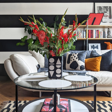 Black and White Striped Lounge with Red Accents