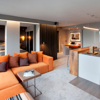 Example of a trendy open concept carpeted and gray floor living room design in Toronto with gray walls