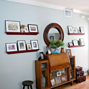 Example of a mid-sized beach style living room design in Tampa with blue walls