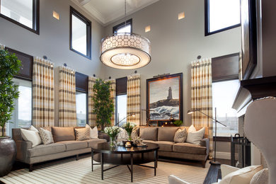 Transitional formal and open concept dark wood floor living room photo in San Diego with gray walls, a standard fireplace and no tv