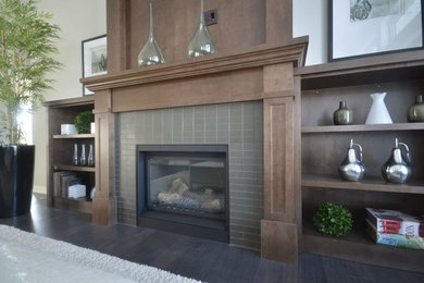 Mid-sized trendy formal and open concept dark wood floor and gray floor living room photo in San Diego with gray walls, a standard fireplace, a tile fireplace and no tv