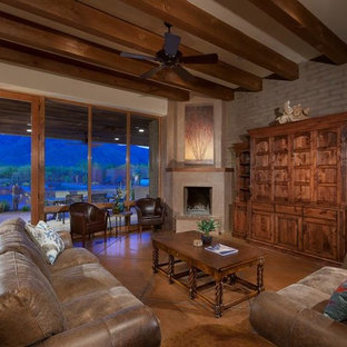 Large elegant open concept concrete floor living room photo in Phoenix with beige walls, a corner fireplace, a plaster fireplace and a concealed tv