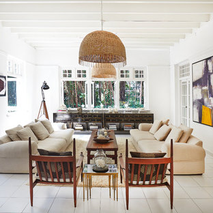 Inspiration for a world-inspired formal enclosed living room with white walls, no fireplace, no tv and white floors.
