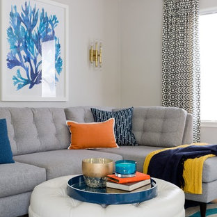 Living room - mid-sized modern enclosed medium tone wood floor living room idea in Los Angeles with gray walls, a standard fireplace, a brick fireplace and a wall-mounted tv