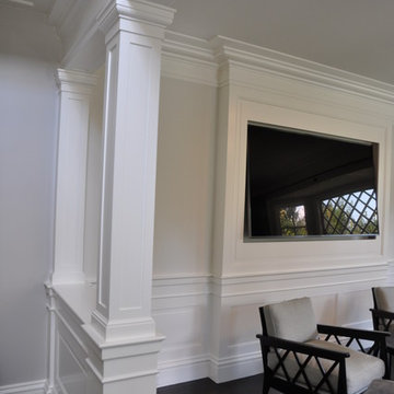 Column & pilaster partition at TV room, wainscoting all around