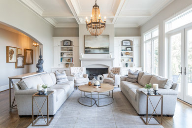 Living room - large transitional medium tone wood floor living room idea in Birmingham with gray walls, a standard fireplace, a stone fireplace and no tv