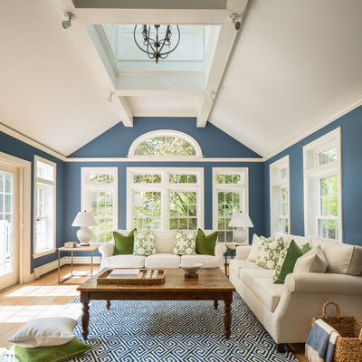 Inspiration for a large timeless formal and enclosed light wood floor living room remodel in Boston with blue walls, no fireplace and no tv