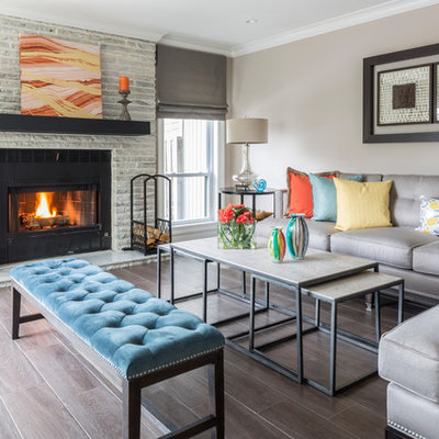 Example of a transitional formal dark wood floor living room design in New York with beige walls, a standard fireplace and a tile fireplace