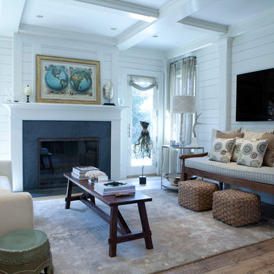 Living room - mid-sized coastal open concept light wood floor living room idea in New York with white walls, a wall-mounted tv, a standard fireplace and a stone fireplace