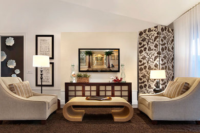 Immagine di un soggiorno contemporaneo aperto e di medie dimensioni con TV a parete, sala formale, pareti bianche, pavimento in cemento, nessun camino e pavimento grigio